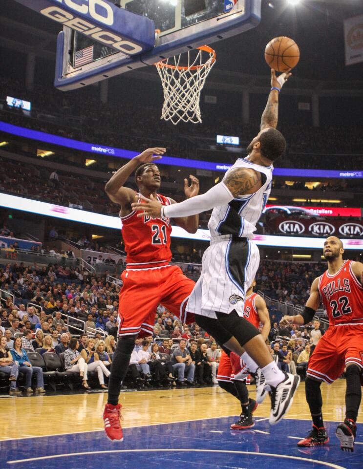 The Magic's Jameer Nelson goes up for a shot against Jimmy Butler during first quarter.