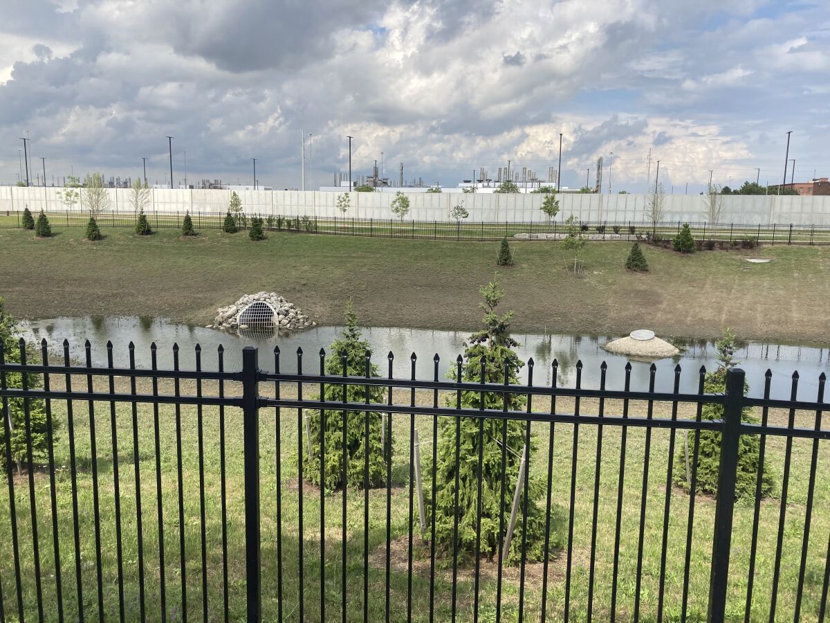 A retention pond at a stormwater park near the new Stellantis Detroit Assembly Complex on the city's eastside is shown June 30, 2021. The park is a greenspace reconfigured to filter rainwater runoff before it flows into sewer systems. (AP Photo/Corey Williams)