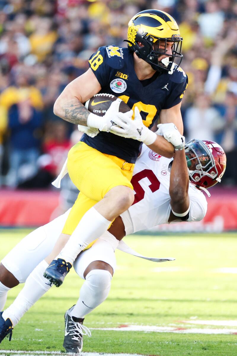 Alabama defensive back Jaylen Key tackles Michigan tight end Colston Loveland during the second quarter at the Rose Bowl on Monday.