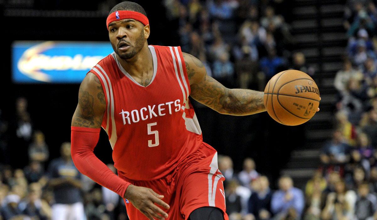 Rockets forward Josh Smith (5) brings the ball up court during his debut with Houston on Friday night.