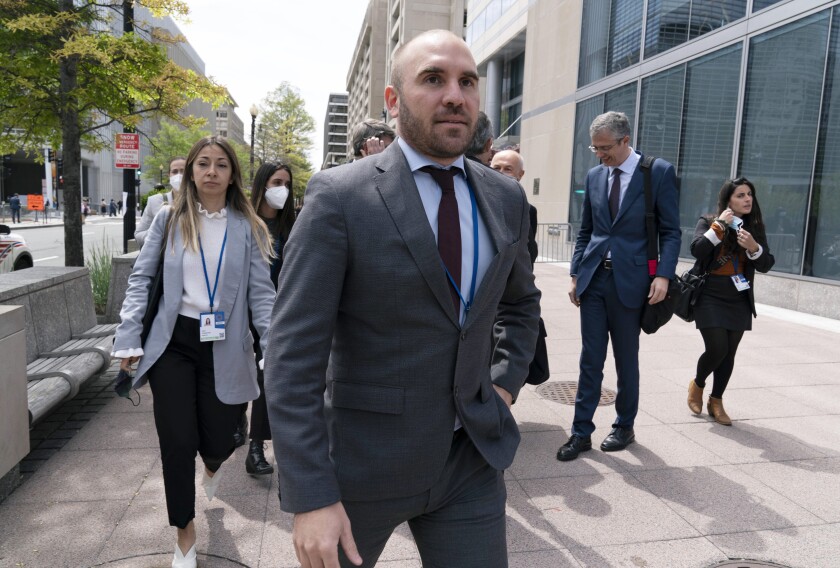 FILE - Argentina's Economy Minister Martin Guzman walks outside of the International Monetary Fund, IMF, building during the IMF Spring Meetings, in Washington, April 21, 2022. Guzman announced his resignation on Saturday, July 2, via twitter. (AP Photo/Jose Luis Magana, File)