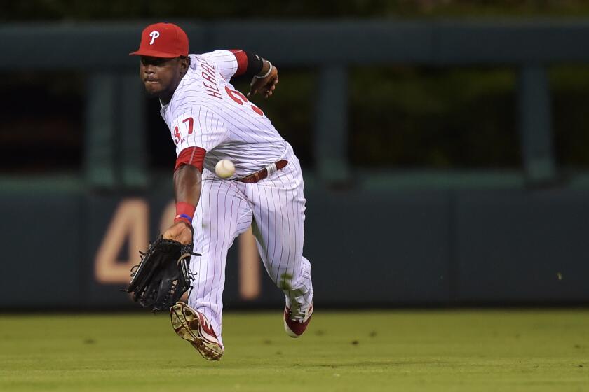 Phillies outfielder Odubel Herrera (37) makes a backhanded catch of a fly ball in the 10th inning against the San Francisco Giants on Aug. 3.