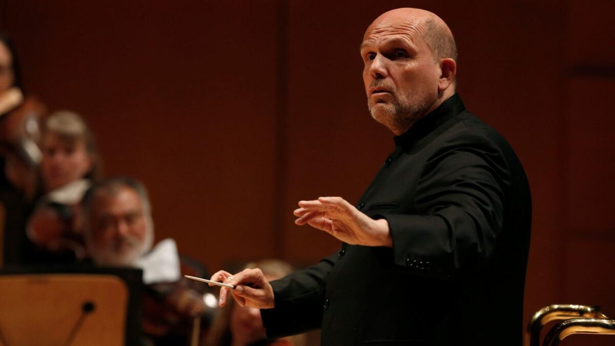 Jaap van Zweden, the New York Philharmonic music director designate, leads the L.A. Phil in a program of Beethoven and Shostakovich fifth symphonies Friday.