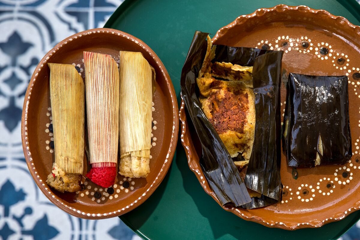 Sweet tamales wrapped in corn husks, left, and tamales wrapped in banana leafs, right, from Tamales Elena Y Antojitos.