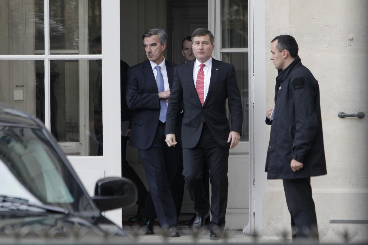 U.S Ambassador to France Charles H. Rivkin, right, leaves the Foreign Ministry in Paris, after he was summoned Monday. The French government was asked to explain why the Americans spied on one of their closest allies.