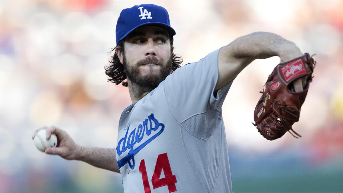 Dodgers starter Dan Haren delivers a pitch during the first inning of a 4-2 win over the Atlanta Braves on Tuesday.