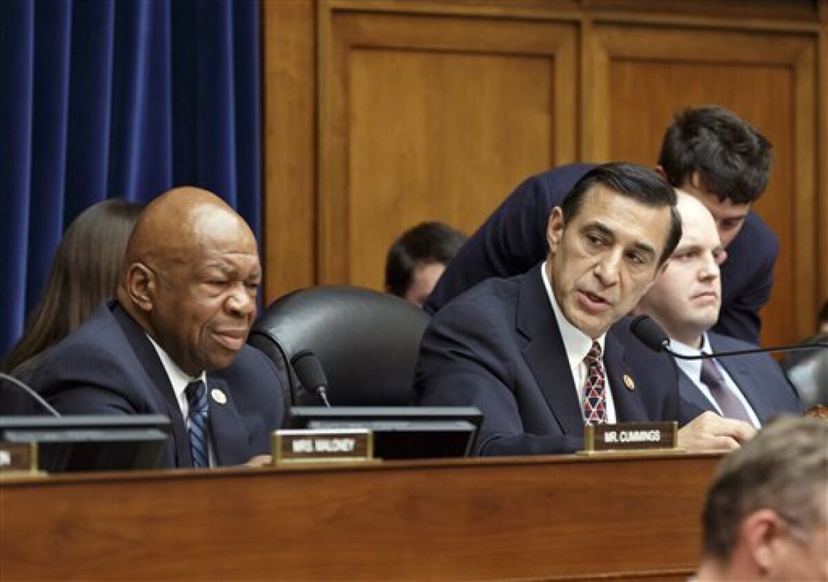 Rep. Darrell Issa, R-Vista., right, then chairman of the House Oversight Committee, joined at left by Rep. Elijah Cummings, D-Md., the ranking member, at a 2015 hearing to determine whether tea party groups were targeted by the Internal Revenue Service.