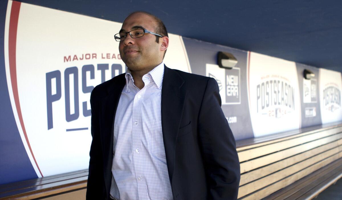 Dodgers General Manager Farhan Zaidi strolls through the dugout at Dodger Stadium last season.