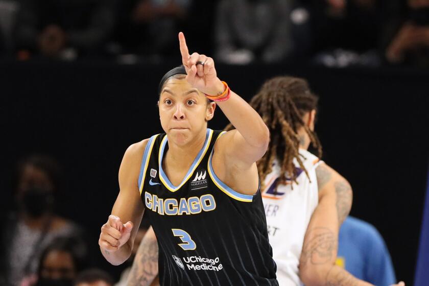 The Sky's Candace Parker reacts after scoring a basket against the Mercury during Game 3 of the WNBA Finals