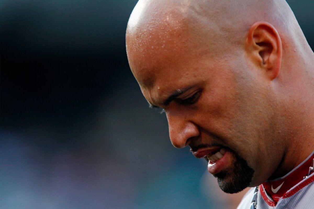 Albert Pujols, above, "would never use illegal drugs in any way," former trainer Chris Mihlfield wrote in response to allegations that he had injected Pujols with performance enhancing drugs during Pujols' early days with the St. Louis Cardinals.