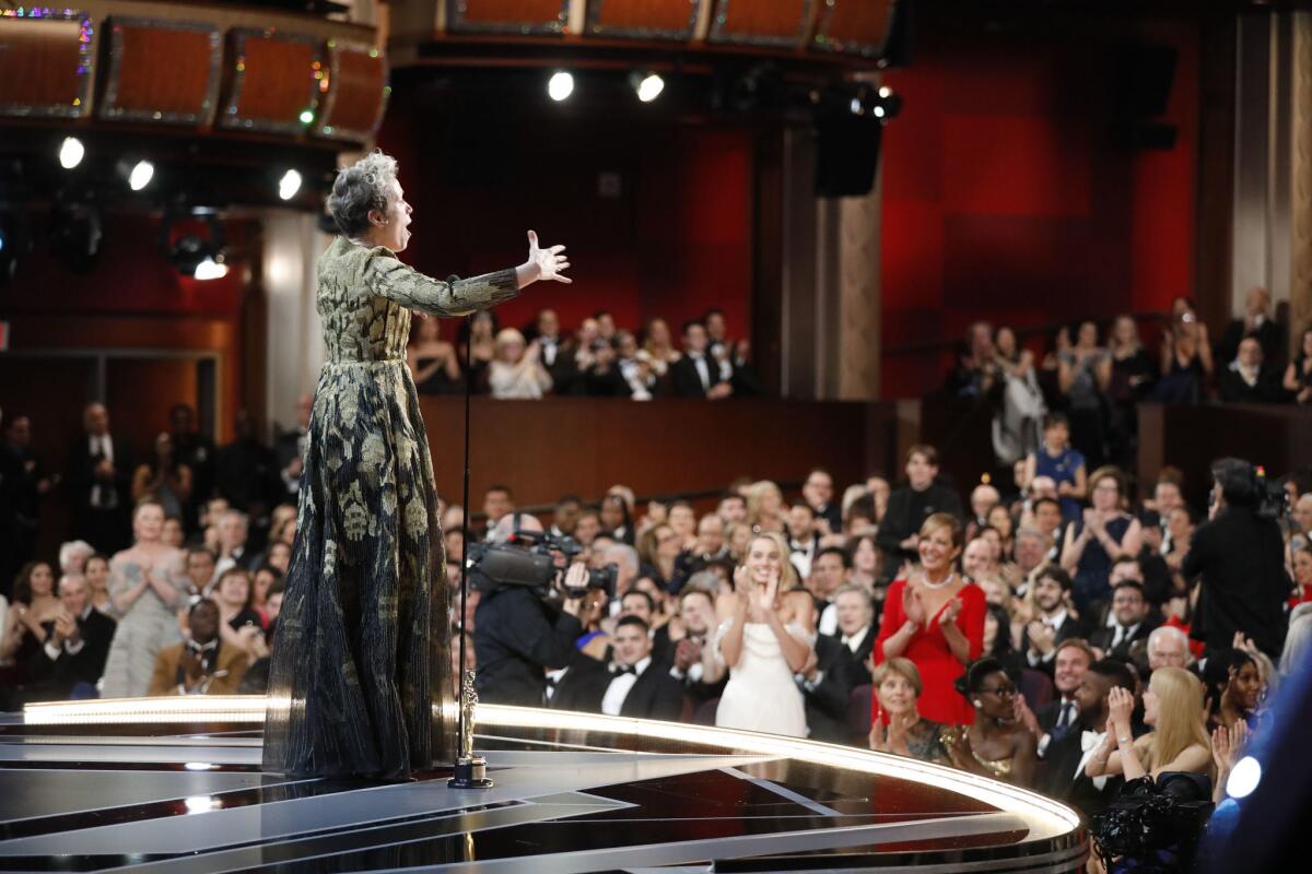 Frances McDormand implores all the women nominated for Oscars in all categories to stand after she wins the Academy Award for lead actress.