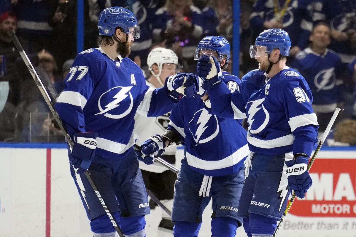 Tampa Bay Lightning defenseman Victor Hedman (77) celebrates his goal against the Los Angeles Kings with center Steven Stamkos (91) during the third period of an NHL hockey game Saturday, Jan. 28, 2023, in Tampa, Fla. (AP Photo/Chris O'Meara)