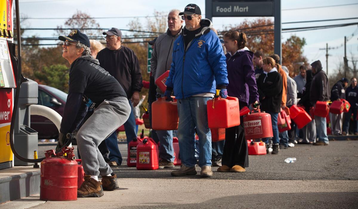 New Jersey residents line up to fill their gas cans at a service station in Hazlet Township after Superstorm Sandy. The Energy Department plans to create a gas reserve in the Northeast to prevent fuel shortages brought by extreme weather.