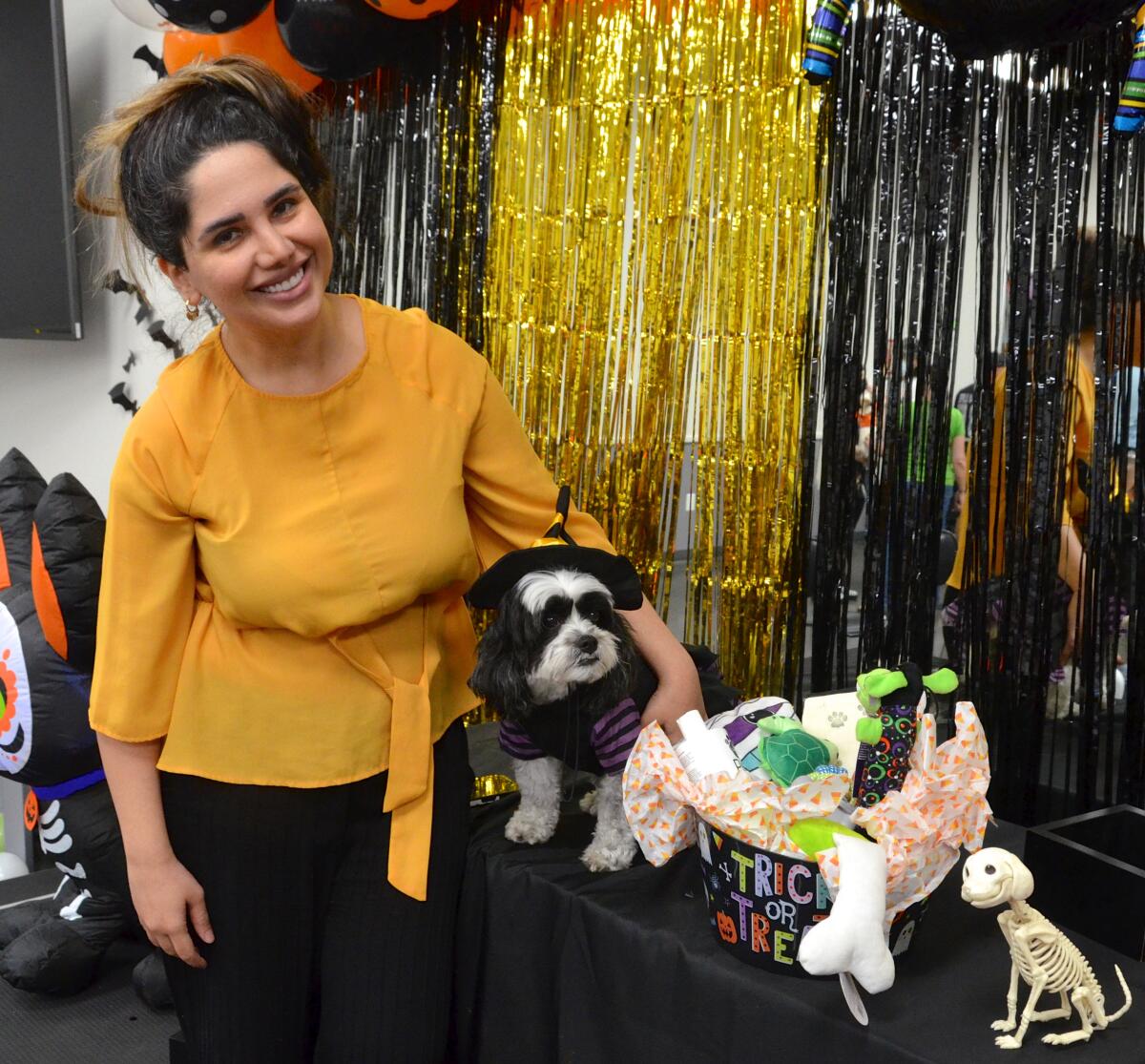 Farzaneh Rafiei with Bella, a Sheshon mix who won first place as a witch.