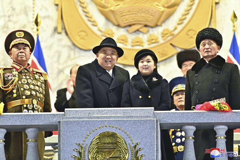 In this photo provided by the North Korean government, North Korean leader Kim Jong Un, center left, with his daughter attends a military parade to mark the 75th founding anniversary of the Korean People’s Army on Kim Il Sung Square in Pyongyang, North Korea Wednesday, Feb. 8, 2023. Independent journalists were not given access to cover the event depicted in this image distributed by the North Korean government. The content of this image is as provided and cannot be independently verified. Korean language watermark on image as provided by source reads: "KCNA" which is the abbreviation for Korean Central News Agency. (Korean Central News Agency/Korea News Service via AP)