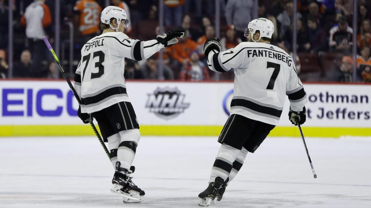 Kings teammates Tyler Toffoli, left, and Oscar Fantenberg celebrate after Toffoli's goal during a shootout in Thursday's 3-2 victory over the Flyers.