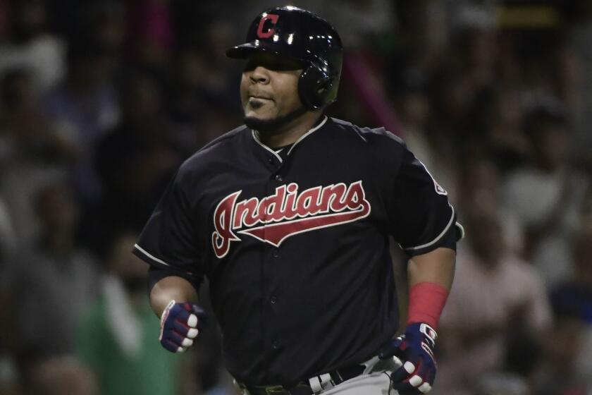 Cleveland Indian's designated hitter Edwin Encarnacion runs the bases after hitting a home run in the fourteenth inning of the final game of a two-game Mayor League Series against the Minnesota Twins at Hiram Bithorn Stadium in San Juan, Puerto Rico, Wednesday, April 18, 2018. (AP Photo/Carlos Giusti)