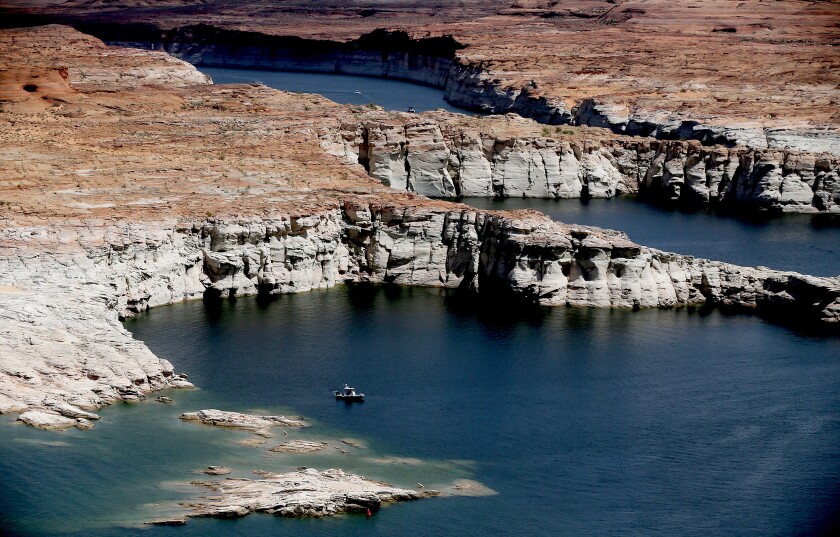 A boat floats on a lake.