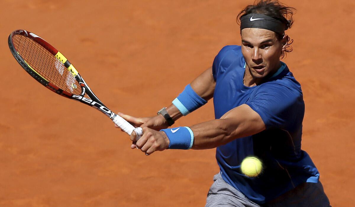 2Rafael Nadal tracks down a shot by Tomas Berdych during a quarterfinal match at the Madrid Open on Friday.