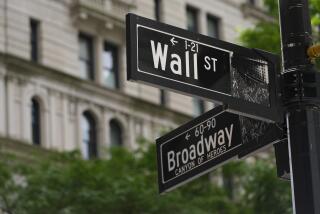 FILE - Signs at the intersection of Wall Street and Broadway streets in New York, June 12, 2024. (AP Photo/Pamela Smith, File)