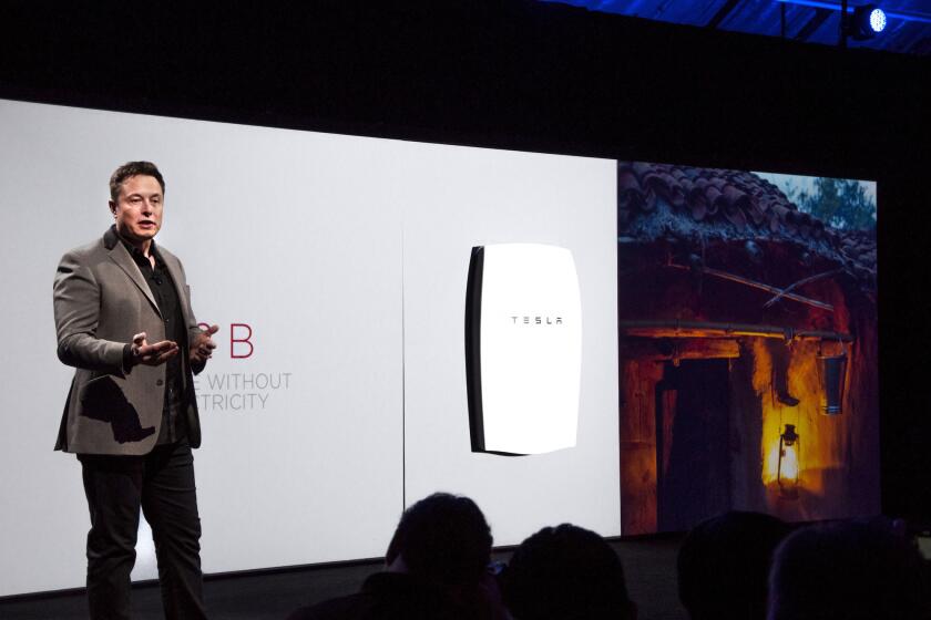 Tesla Motors CEO Elon Musk introduces the Powerwall residential battery at the automaker's design studio in Hawthorne on April 30, 2015.