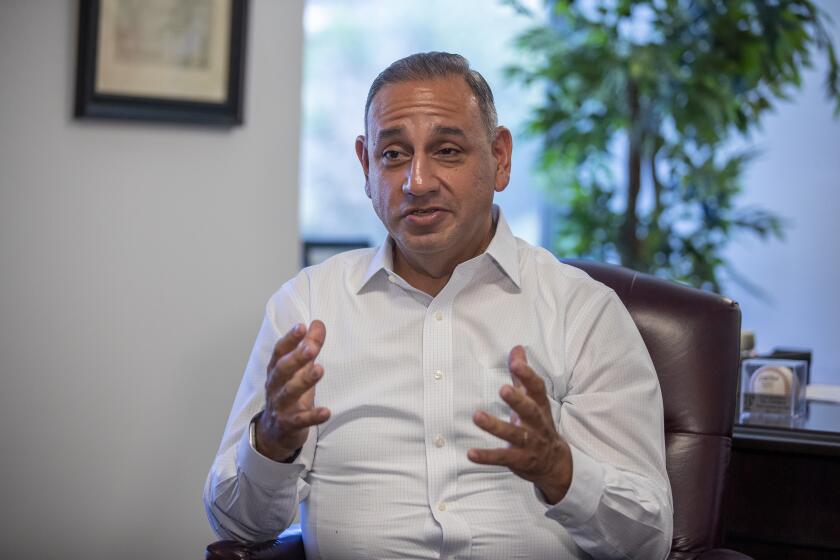 FULLERTON, CALIF. -- SUNDAY, JULY 21, 2019: Rep. Gil Cisneros talks as he hosts constituent office hours at his office in Fullerton Sunday, July 21, 2019. Photo taken in Fullerton, Calif., on July 21, 2019. (Allen J. Schaben / Los Angeles Times)