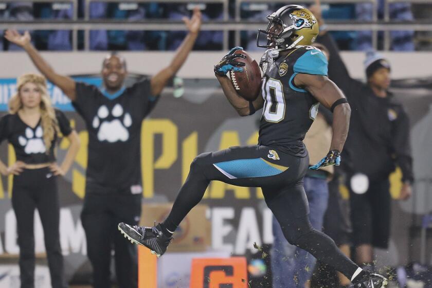 Jacksonville running back Jordan Todman scores on a 62-yard touchdown during a 21-13 win over the Tennessee Titans on Monday.