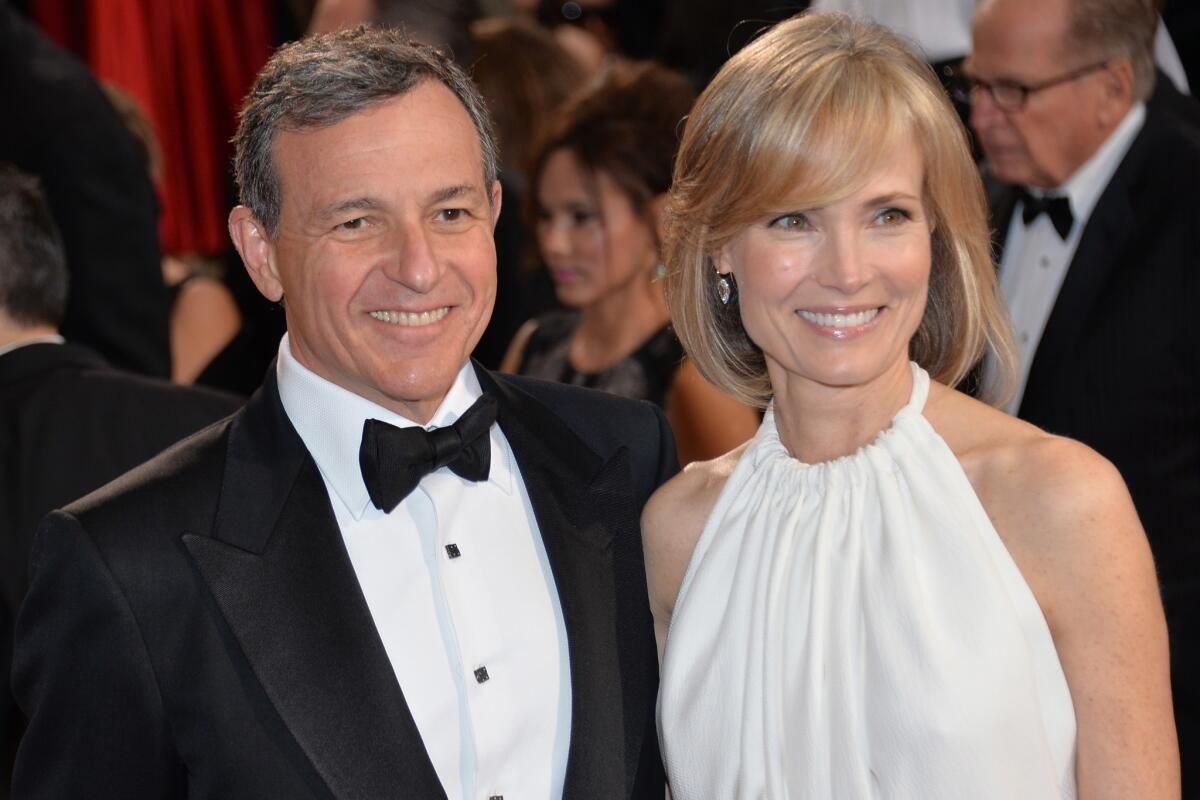 Bob Iger, chairman and chief executive of the Walt Disney Co., and wife Willow Bay attend the Oscars in 2014.