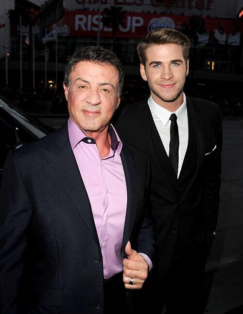 Sylvester Stallone, with Liam Hemsworth, stops by the red carpet premiere.