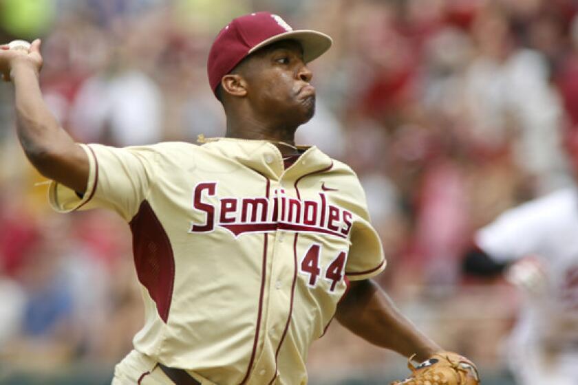 Florida State's Jameis Winston delivers a pitch during an NCAA super regional game in June. The Heisman Trophy winner will pitch against the New York Yankees in a spring training exhibition game Tuesday.