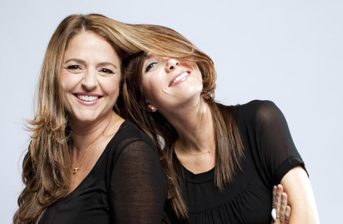 "Bridesmaids" writers Annie Mumolo, left, and Kristen Wiig are reuniting for a comedy for TriStar.