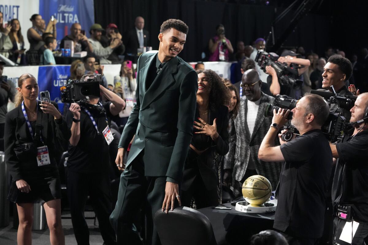 Victor Wembanyama walks to the stage during the NBA draft