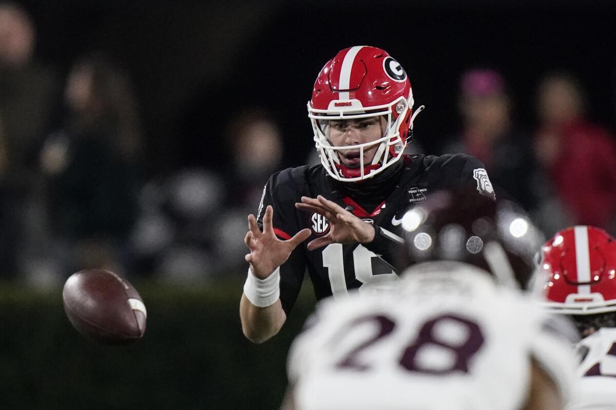 Georgia quarterback JT Daniels takes a snap during a win over Mississippi State on Saturday.