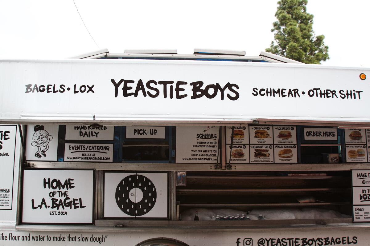 A photo of the side of a black-and-white Yeastie Boys truck.