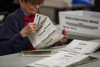 Phoenix, AZ - November 09: Election workers look over ballots for readability at the Maricopa County Tabulations and Election Center the day after the midterm elections on Wednesday, Nov. 9, 2022 in Phoenix, AZ. (Gina Ferazzi / Los Angeles Times)