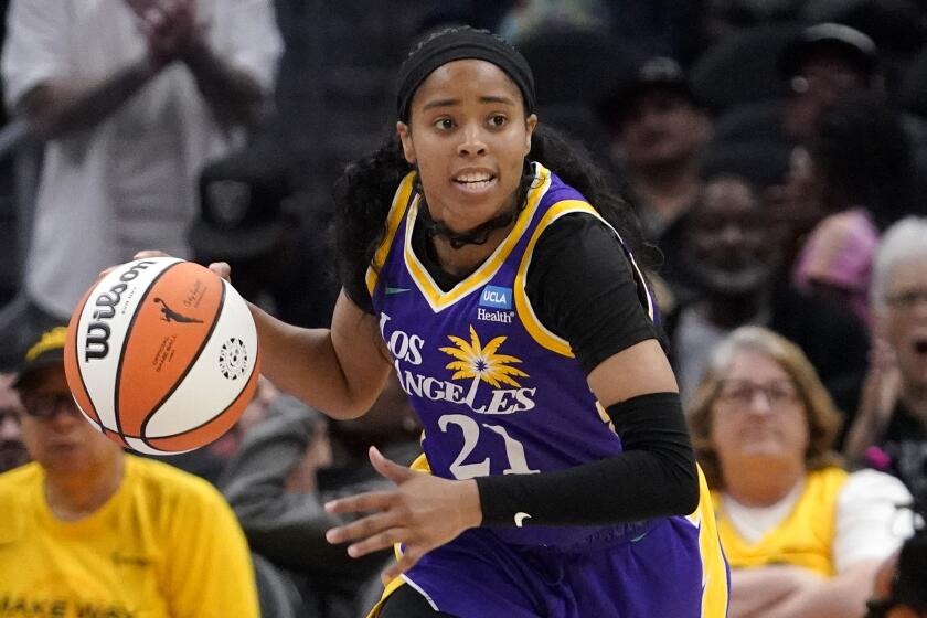 Los Angeles Sparks guard Jordin Canada dribbles during the second half of a WNBA basketball game.
