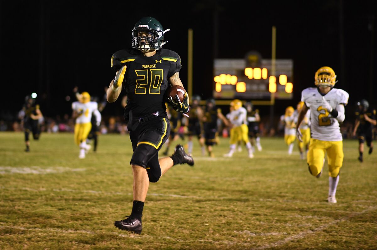 Paradise's Lukas Hartley runs with the ball during Friday's game against Williams.