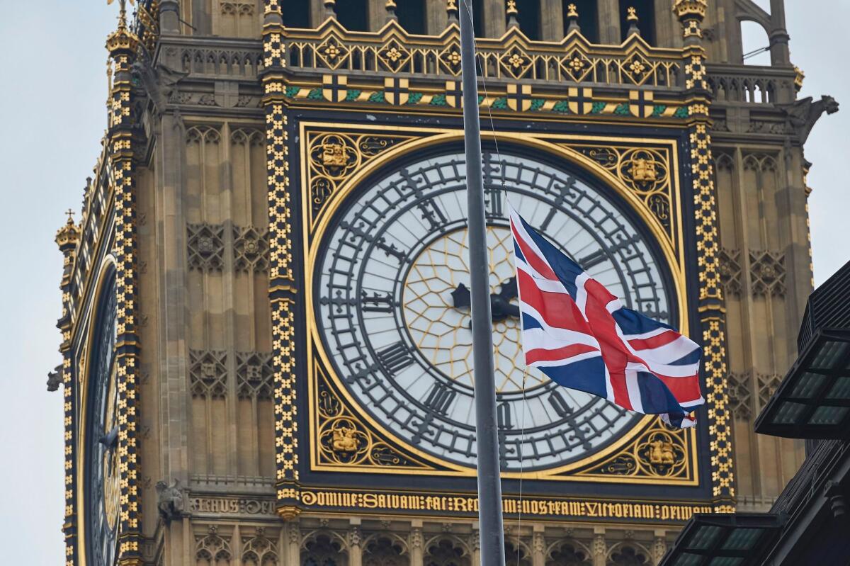 The Union Jack flies at half-staff in front of Big Ben at the Houses of Parliament in central London.