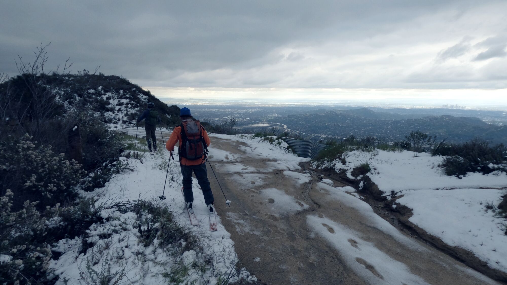 Skiers make their way over the summit of Mt. Lukens on Sunday.