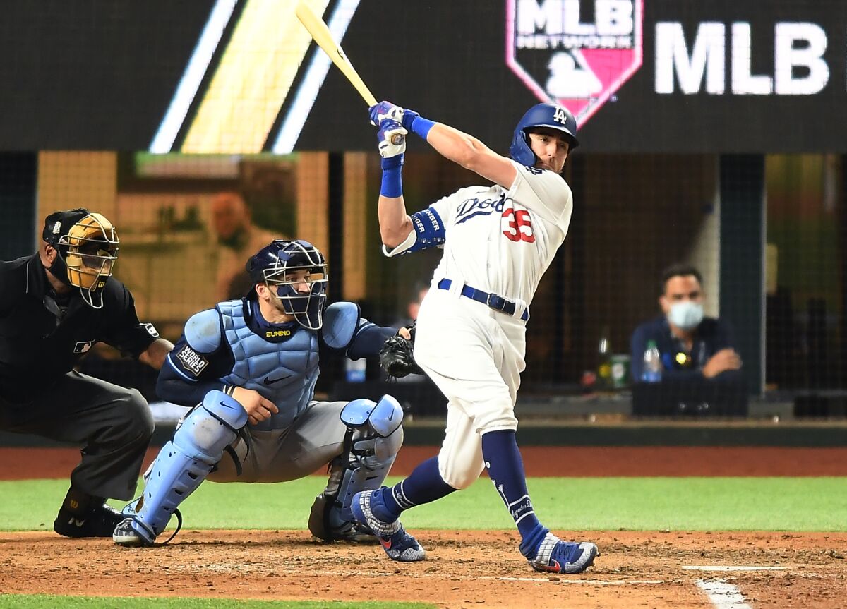 Cody Bellinger follows through on a swing that brought him a home run.