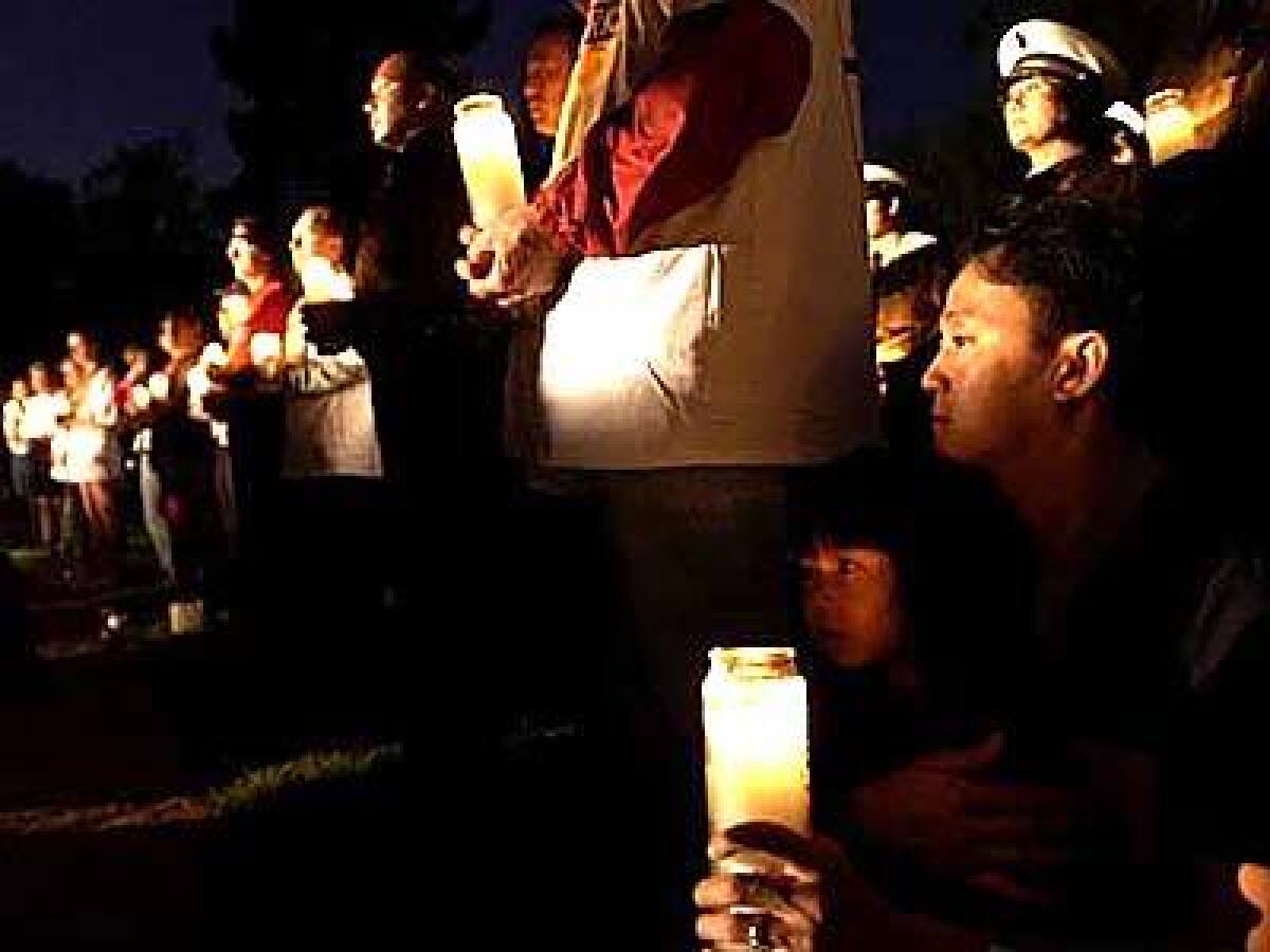 Residents joined fire and police officials during an early-morning candlelight memorial service at North Hollywood Park.