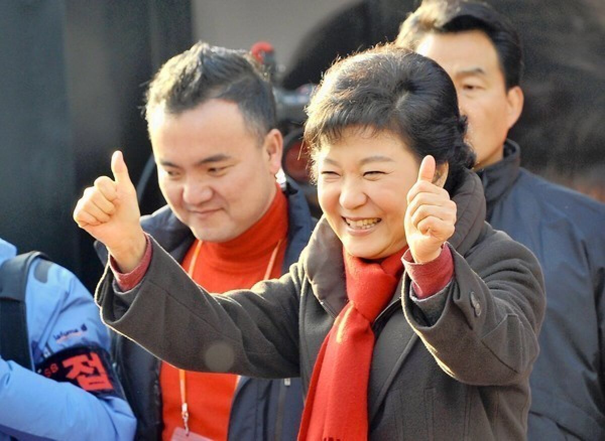 South Korean presidential candidate Park Geun-hye campaigns in Suwon, south of Seoul. She could become the country's first female president.