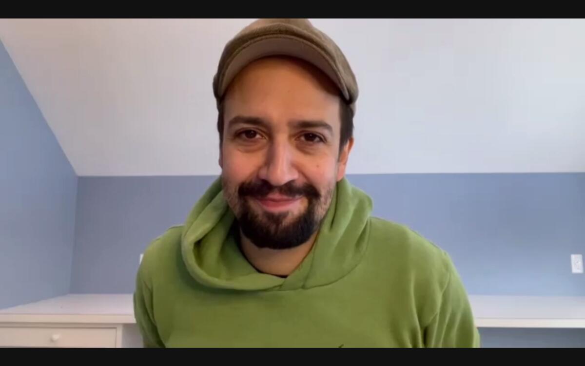 Lin-Manuel Miranda in a green hoodie