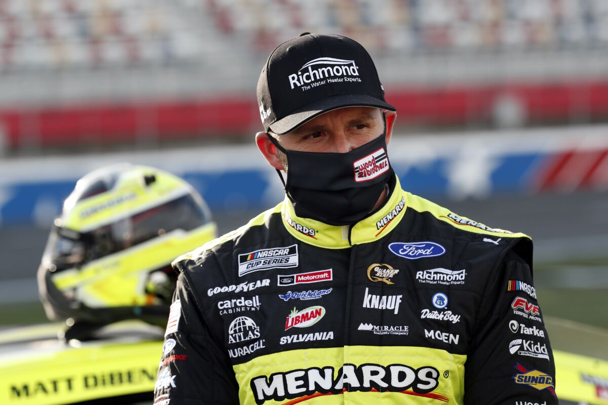FILE - In this May 28, 2020, file photo, Matt DiBenedetto waits for the start of a NASCAR Cup Series auto race at Charlotte Motor Speedway in Concord, N.C. DiBenedetto, Ryan Blaney, William Byron and Cole Custer are the four drivers below the cutline headed into the knockout race. (AP Photo/Gerry Broome, File)