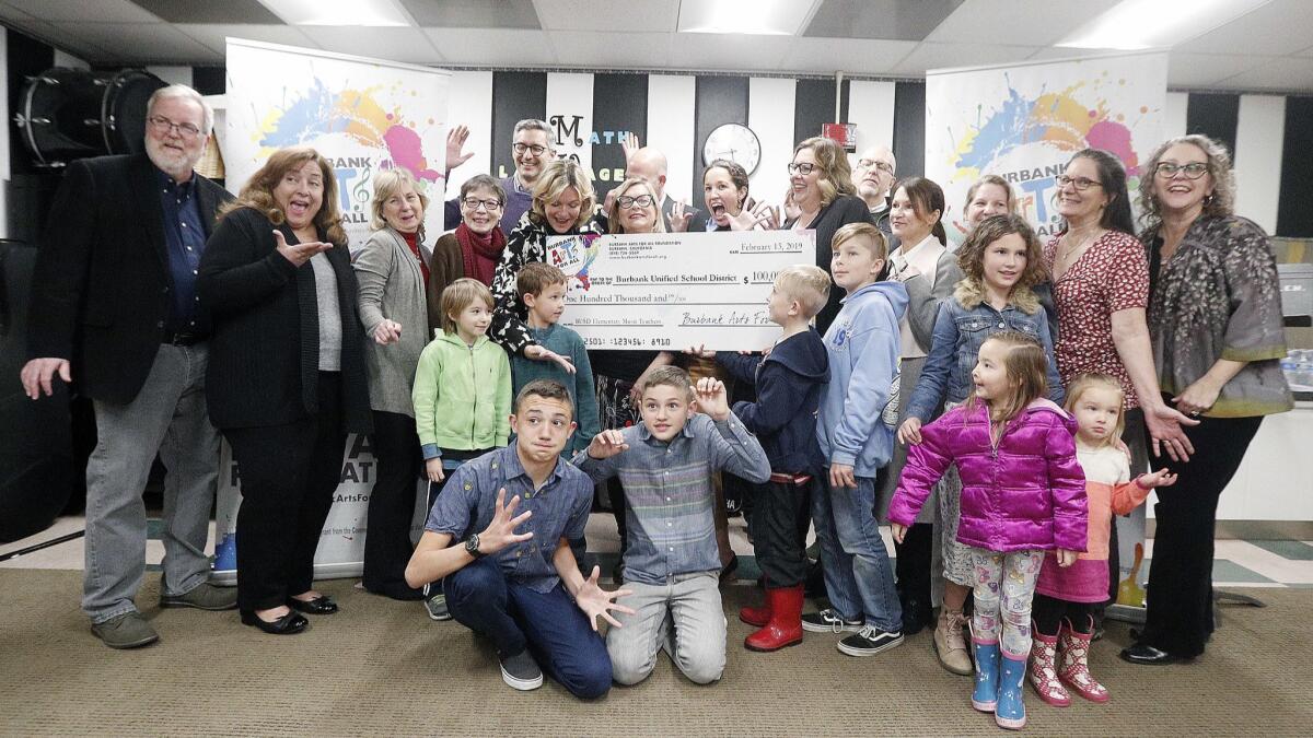 The Burbank Arts For All Foundation donated a check for $100,000 to the Burbank Unified School District during a presentation at Roosevelt Elementary School on Wednesday. The money will help support the Burbank Unified's arts education program.