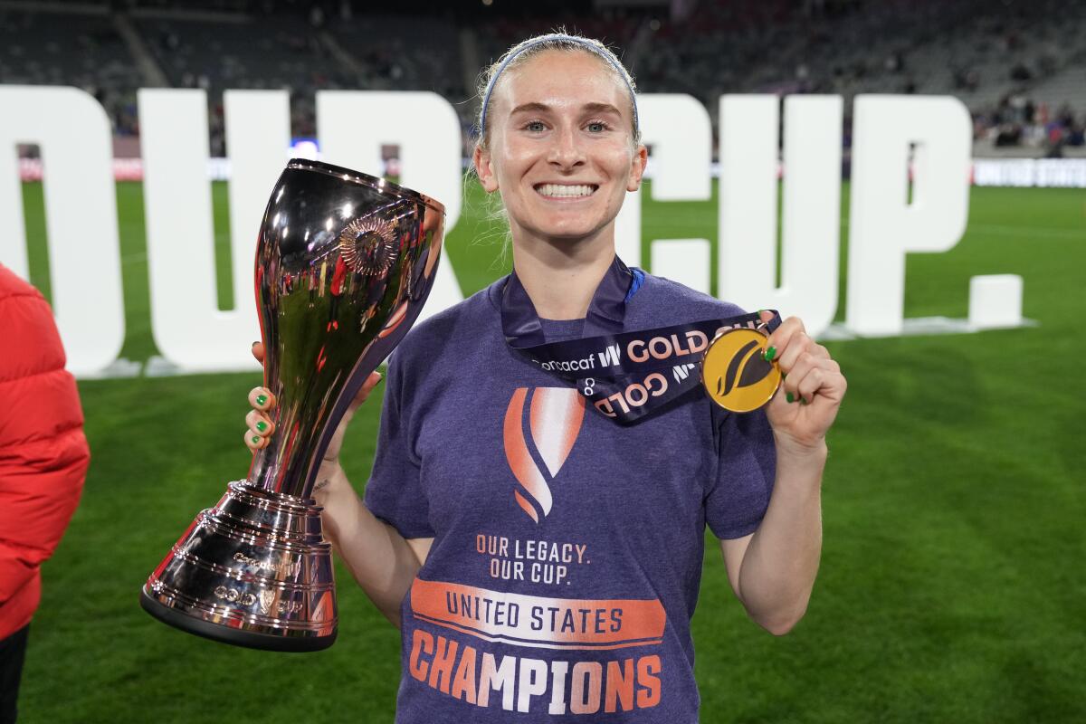 Huntington Beach native Jenna Nighswonger is all smiles after Team USA won the Concacaf W Gold Cup.