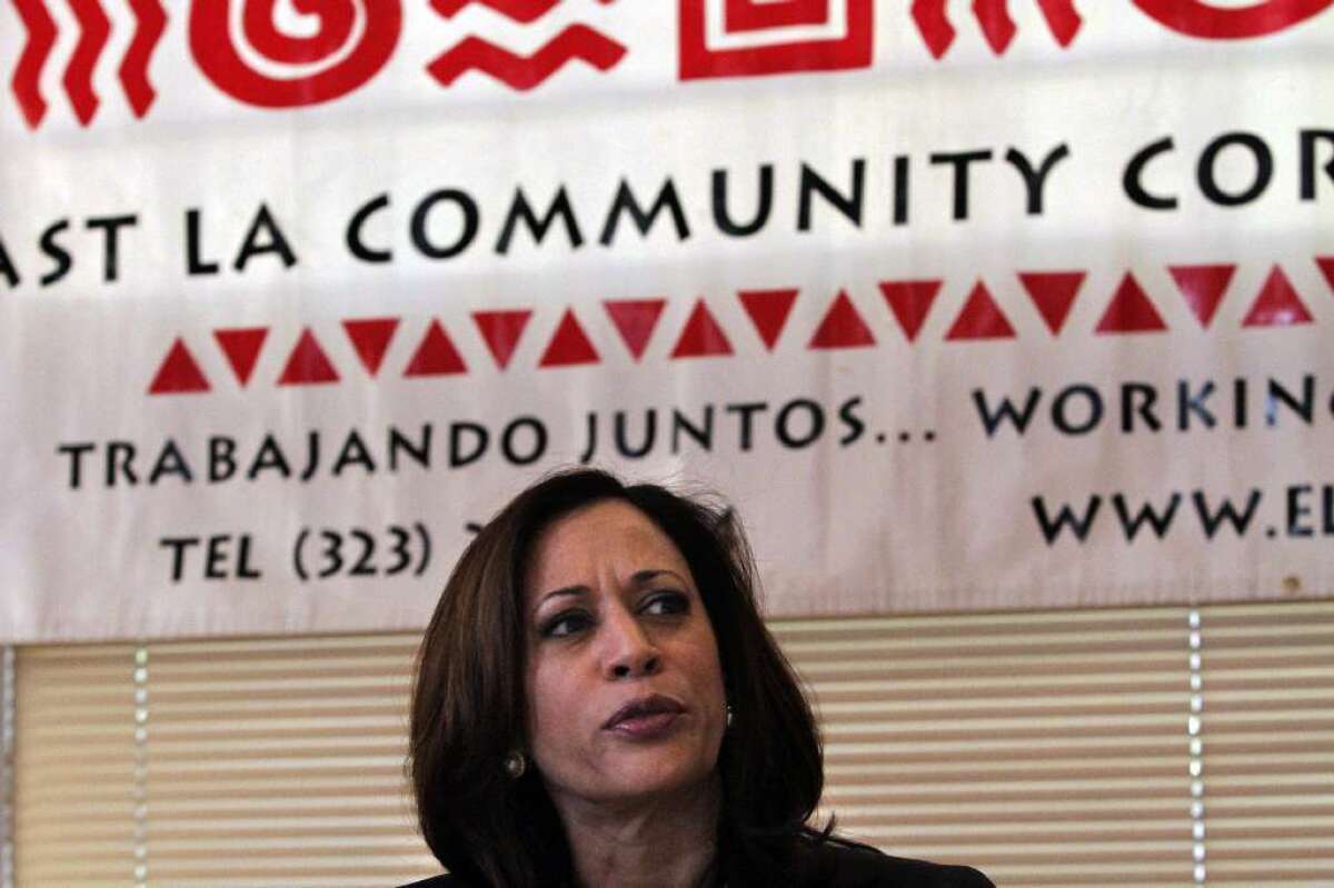 California Atty. Gen. Kamala D. Harris pictured in East Los Angeles talking to housing counselors.