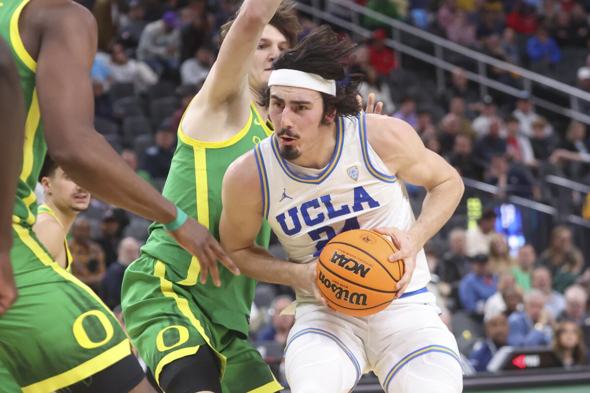 UCLA guard Jaime Jaquez Jr. drives to the basket during a win over Oregon in the Pac-12 tournament on March 10.