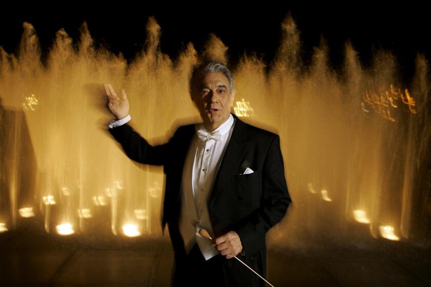 Gary Friedman  Los Angeles Times PLÁCIDO DOMINGO, always at the center of L.A. Opera, was in maestro mode for a fall 2006 photo on the Music Center plaza. He was then conducting “Manon.”
