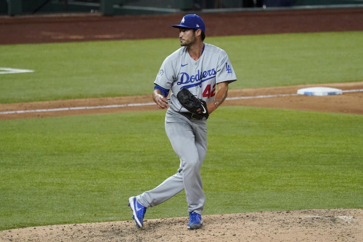 Dodgers pitcher Mitch White follows through on his delivery against the Texas Rangers on Aug. 28, 2020.